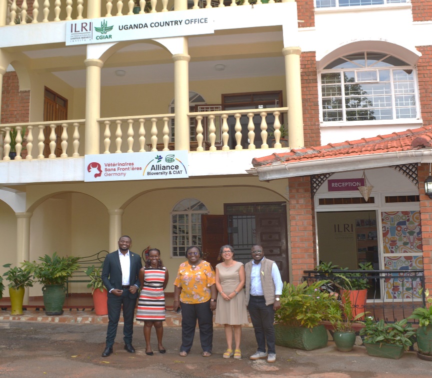 A group of people standing in front of a building</p>
<p>AI-generated content may be incorrect.