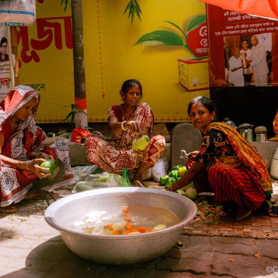 Women prepare vegetables for a wedding ceremony at a Hindu temple in Dhaka, Bangladesh. 